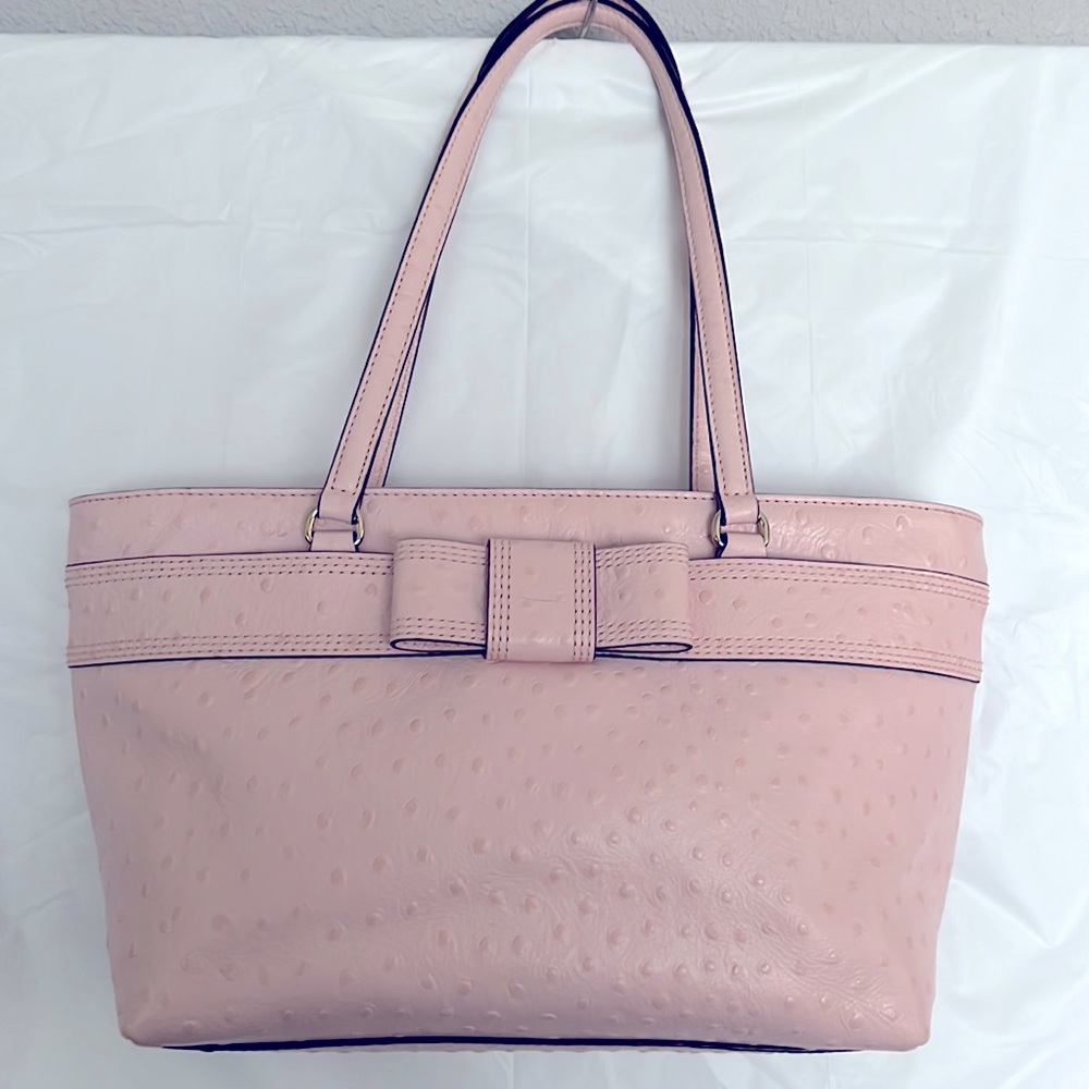 Kate Spade bag with 9” handles.